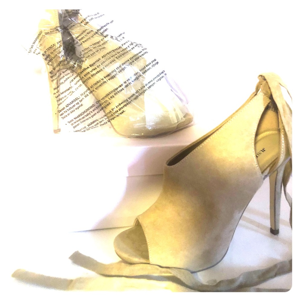 Peep toe, tan, tie up stilletos.